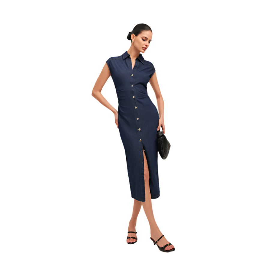 Woman wearing a navy blue dress with a front slit on a white background