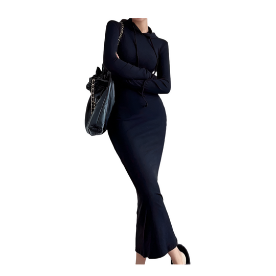 Person wearing a black dress with a white background